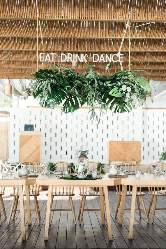 custom neon wedding sign that says "eat.drink.dance."