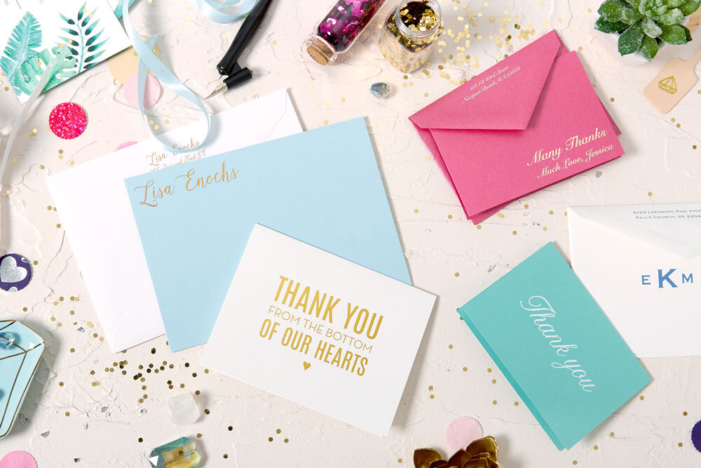 display of custom stationery from For Your Party, including a blue grande notecard
