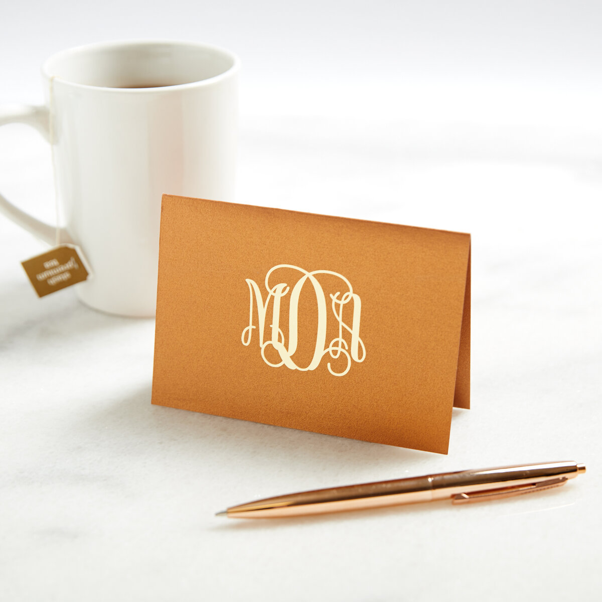 Gift a copper monogrammed note card with copper pen for a custom anniversary gift