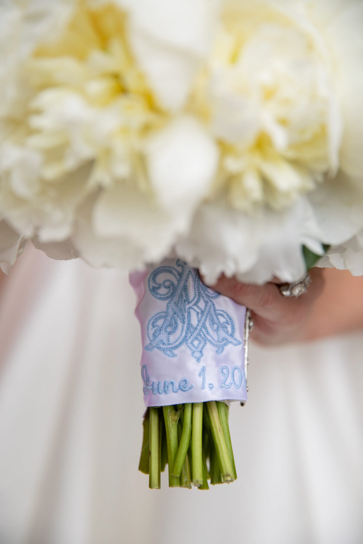 embroidered monogram on bride's bouquet in Preppy Pink Luxury wedding