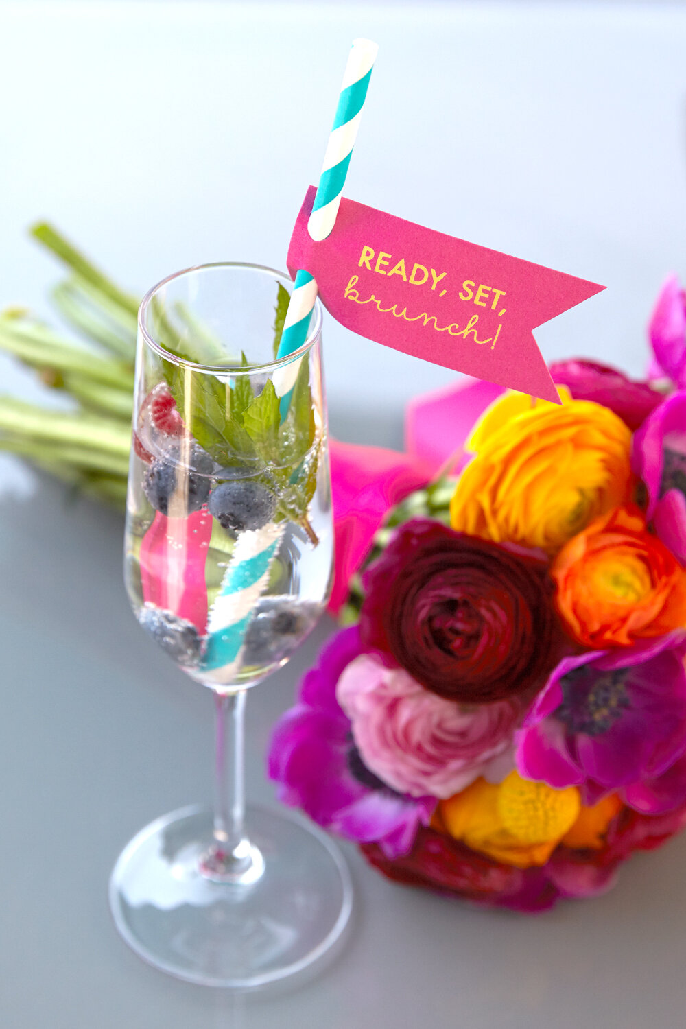 vodka cocktail with la croix and a personalized straw tag