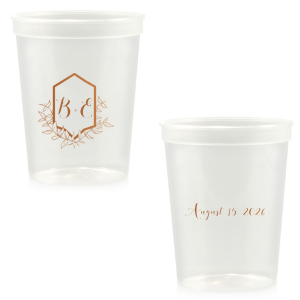 Sip with pride from the Family Crest Initials Cup, where a modern emblem blooms with hand-drawn foliage, reminiscent of ivy-clad ancestry. The couple's script initials rest within, and the event date on the reverse, crafting a legacy in each toast.