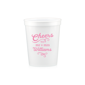 The Swirling Cheers Cup exudes exuberance. The design features "Cheers" fancifully scripted, underscored by a flourish. Below, the couple's titles "Mr. and Mrs." lead into their last name, further accentuated by an ornate flourish. These swirling designs add a sense of fanciful charm, making the cup a perfect vessel for toasting. 