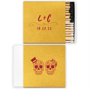 Celebrate eternal love with the Skull Couple Wedding Matchbox. Adorned with delightful sugar skulls, these matchboxes honor Dia de los Muertos—celebrating life and love. The back features the newlywed's initials and the event date, making it a unique token of vibrant tradition and joy.