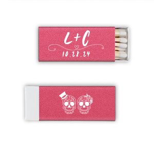 Celebrate eternal love with the Skull Couple Wedding Matchbox. Adorned with delightful sugar skulls, these matchboxes honor Dia de los Muertos—celebrating life and love. The back features the newlywed's initials and the event date, making it a unique token of vibrant tradition and joy.