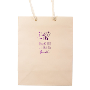 The Sweet 16 Bag exudes youthful joy with its swirling script celebrating the milestone birthday. Flourished 'Sweet' over a bold '16', coupled with a grateful 'Thanks for Celebrating' and the birthday star's name, makes this design a perfect, vibrant token for any Sweet Sixteen bash.