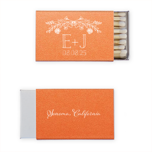 Ignite memories with the Floral Wedding Matchbox, where vintage florals crown the couple's initials and date. On the back, the event's locale is sweetly scripted, making each spark a timeless reminder of your special day.