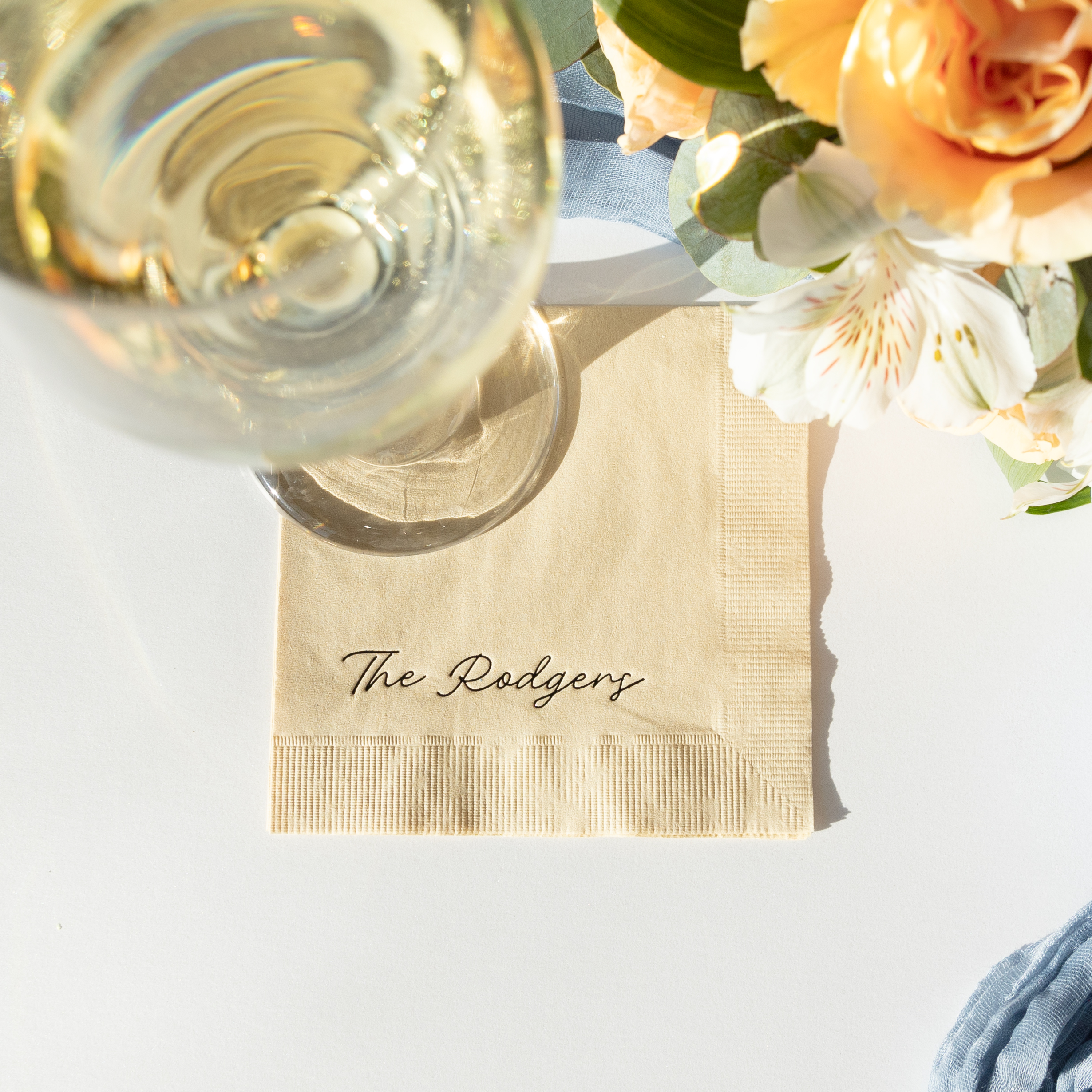 handwritten script family name, cocktail napkin