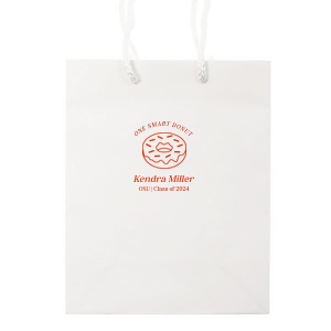 Pack up the celebration with the Clever Donut Grad Bag, tailored with the graduate’s name, school, and graduation year, complemented by a charming donut graphic and the witty phrase “One Smart Donut.” A perfect blend of humor and accolade for their scholastic achievements.