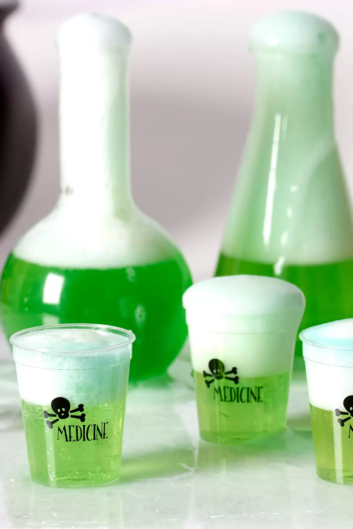 Use custom Halloween shot glasses as a fun small scale serving of yummy mocktail drinks for kids!