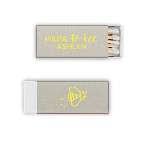 Strike up excitement for the 'Mama to Bee' with these adorable matches, buzzing with anticipation. The Mama to Bee Matchbox design has a sweet bee gracing the back, while the front honors the guest of honor, kindling joy for the baby's impending arrival.
