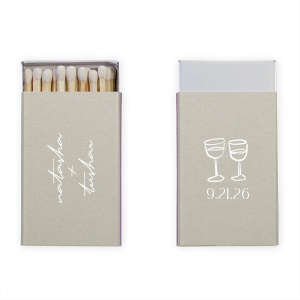 Light up your autumnal love story with the Boho Terracotta Line Art Wedding Matchbox. Customize one side with the couple's names elegantly scripted, symbolizing unity. The other side is adorned with a minimalist line drawing of two clinking wine glasses, topped by the wedding date in a refined serif font, ready to commemorate your chic, moody celebration.