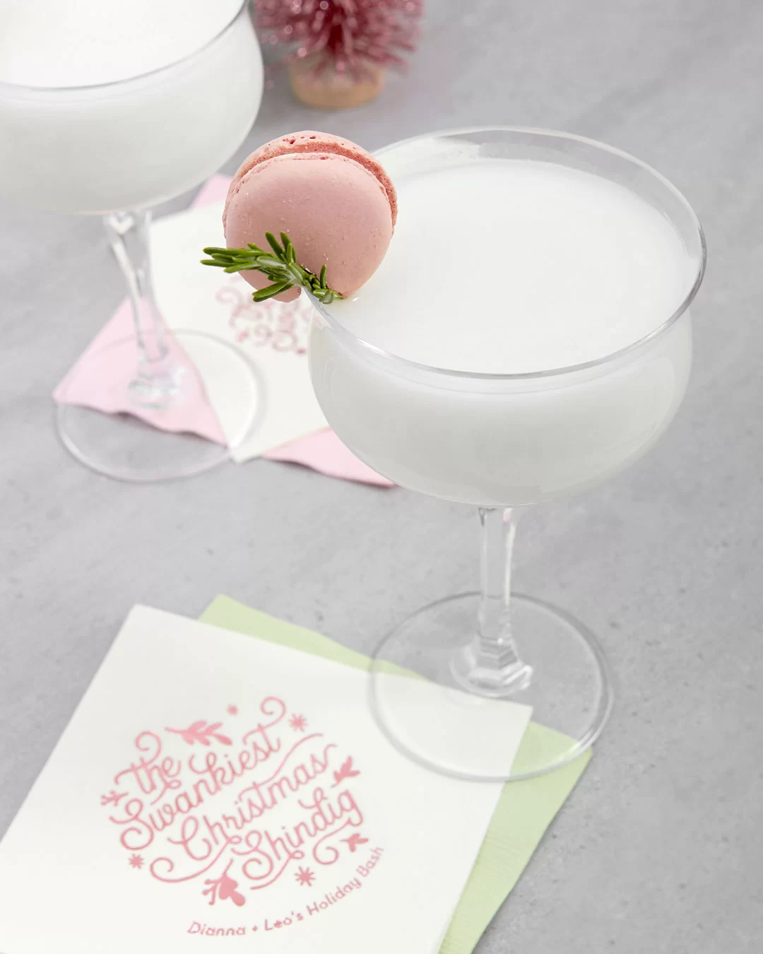 creamy rum cocktail recipe with rose syrup and a custom cocktail napkin