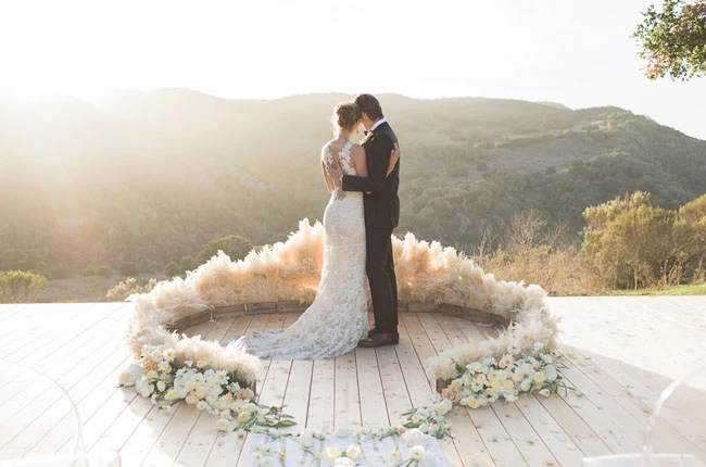 pampas grass halo at incredible mountain view wedding ceremony