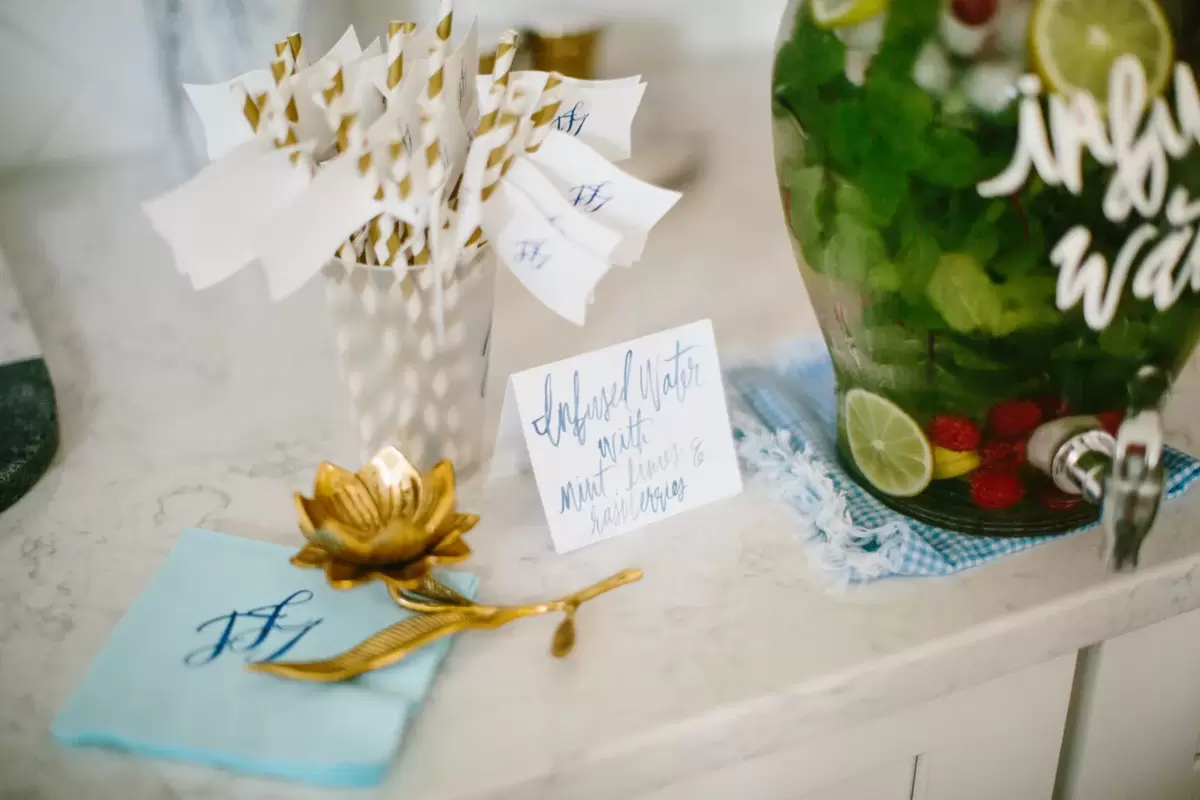 boy baby shower water station ideas with infused water and watercolor signs