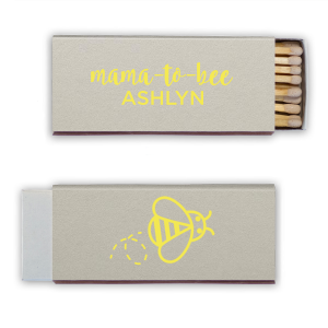 Strike up excitement for the 'Mama to Bee' with these adorable matches, buzzing with anticipation. The Mama to Bee Matchbox design has a sweet bee gracing the back, while the front honors the guest of honor, kindling joy for the baby's impending arrival.