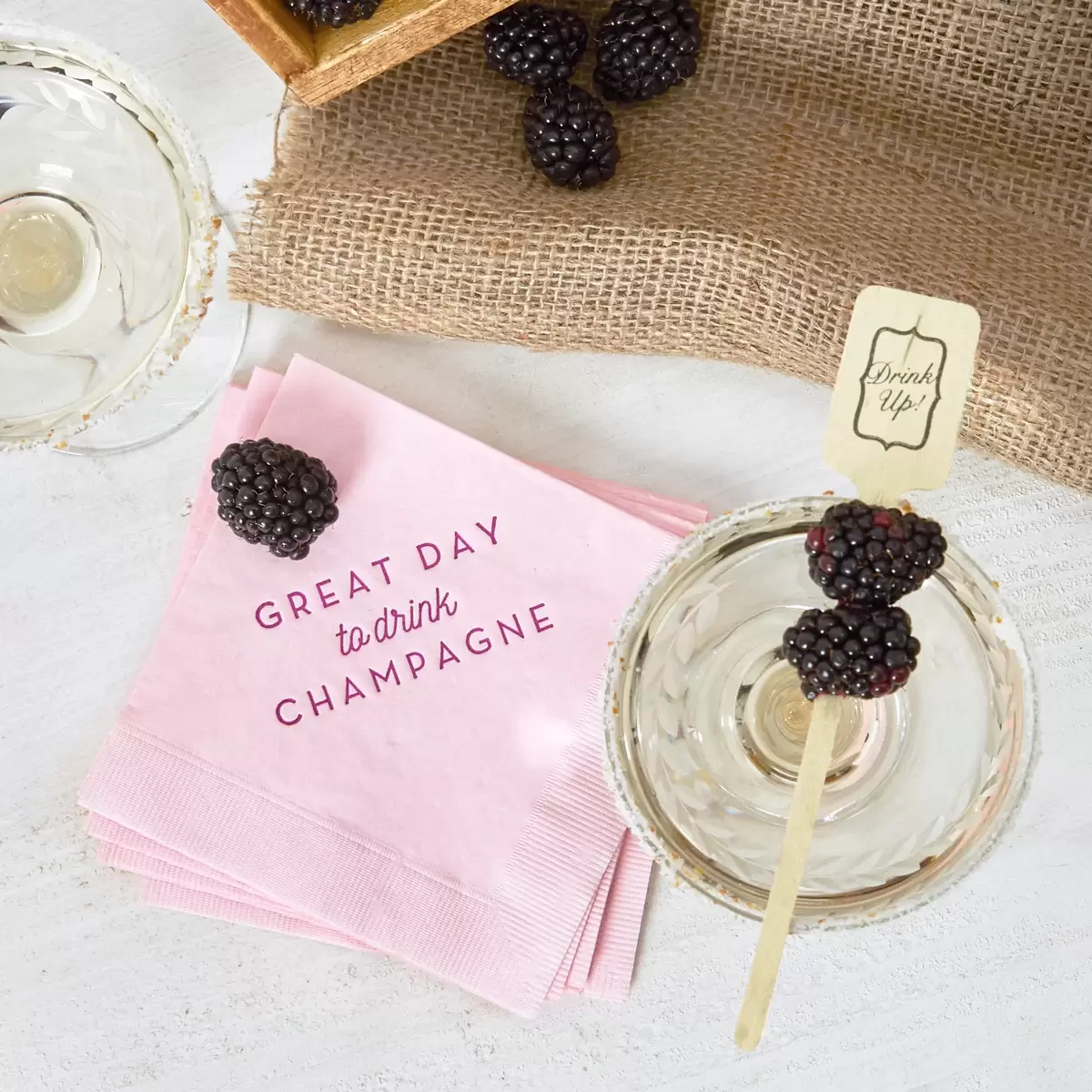 blackberry champagne with personalized cocktail napkins