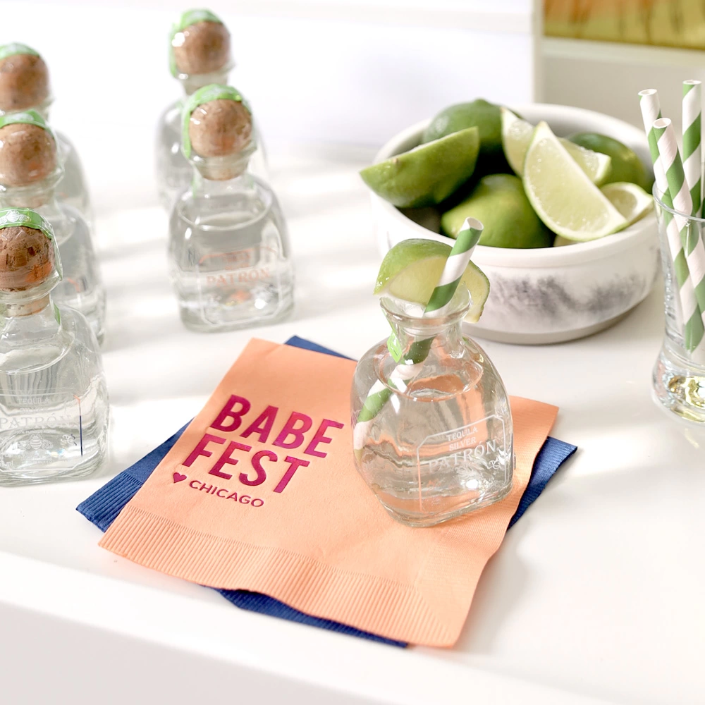 bachelorette party bar cart with personalized cocktail napkins