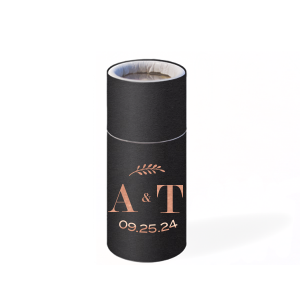 The Leaf Initials Matchbook design showcases a sleek, modern font for the couple's initials, artfully linked by a diminutive ampersand. An elegantly arched bough floats above, adding a natural touch. Below, the event date subtly arcs, complementing the design's fluidity and contemporary charm.