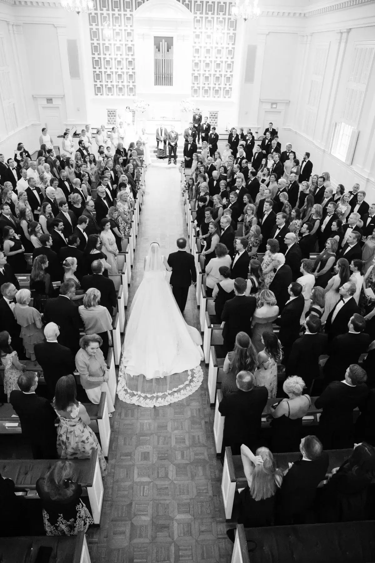 overhead photo of bride walking the aisle at her Preppy Pink Luxury wedding
