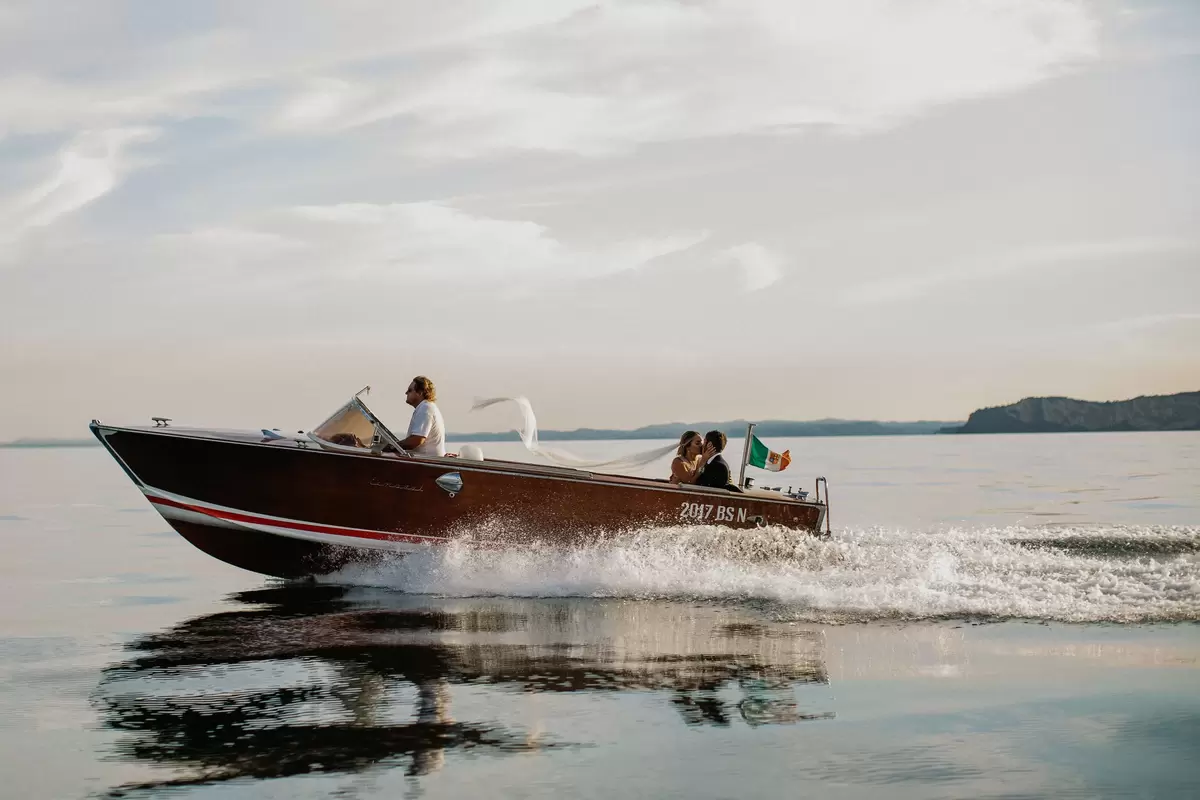 Brie Doffing wedding getaway boat photo