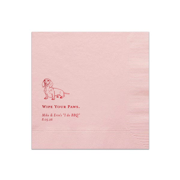 The Dachshund Wipe Your Paws Wedding Napkin delightfully blends humor and pet affection. It showcases a cheerful dachshund illustration above the witty phrase "WIPE YOUR PAWS," playfully connecting napkin utility with the couple's fondness for their dog. Beneath this fun phrase are the couple's names and event date, adding a personalized element.