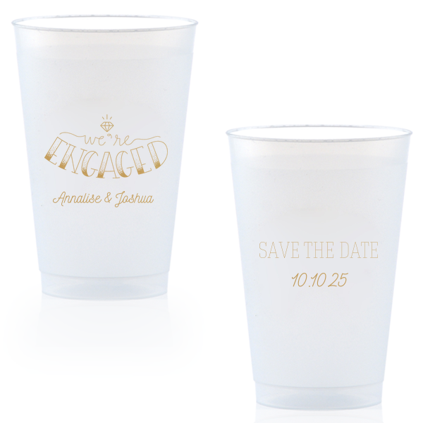 The Diamond Engagement Cup design dazzles with a sparkling diamond graphic and bold "ENGAGED" in 3D artistry. Scripted "we’re" and the couple's names add charm, while the other side cheerfully announces "Save the Date," infusing the cup with celebratory excitement and anticipation.