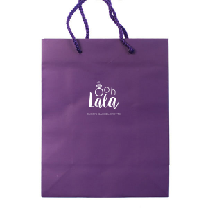 Delight guests with the Ooh Lala Bachelorette Bag, where a glimmering solitaire ring cleverly becomes the 'O' in 'Ooh.' 'Lala' whimsically precedes the bride-to-be's name, making this bag a charming memento of celebration and friendship.