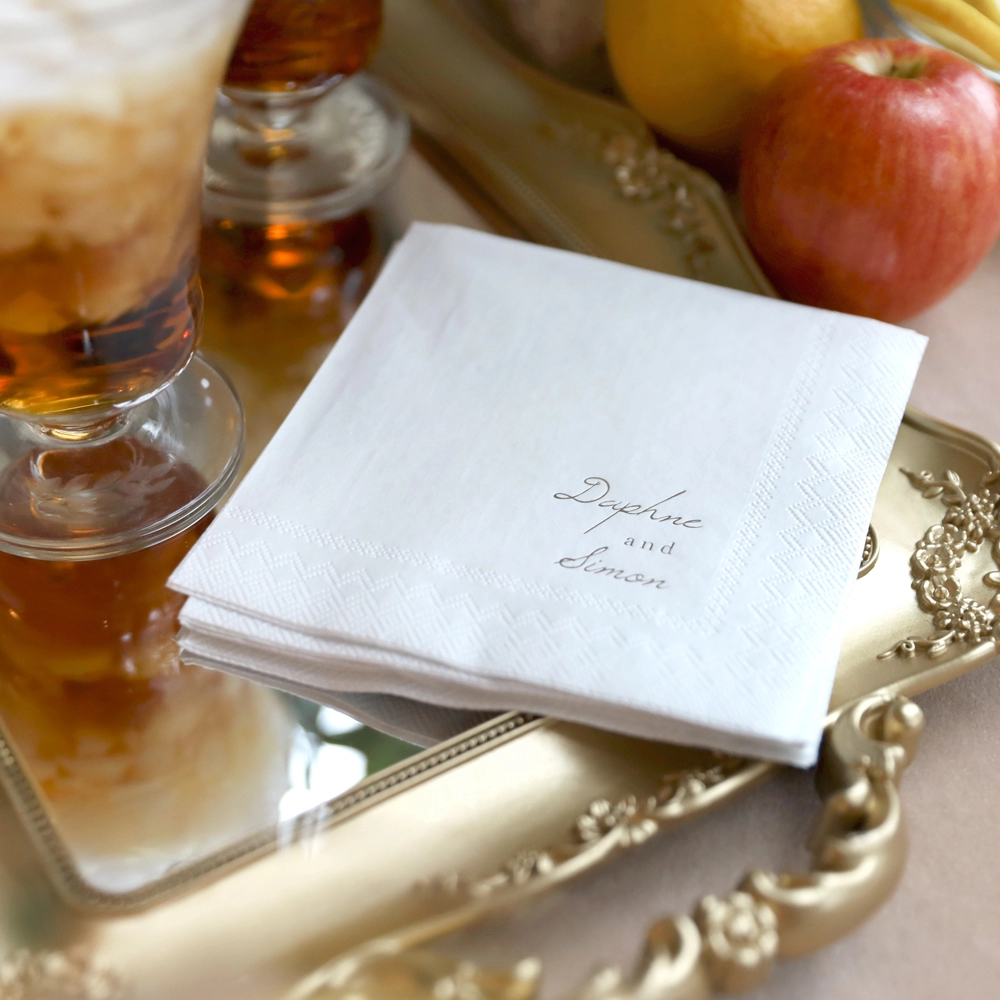 Personalized cocktail napkins inspired by Netflix's Bridgerton, a huge 2022 wedding trend