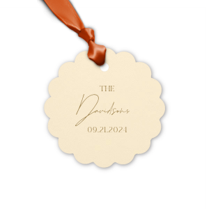 Add a personalized touch to your wedding favors with the Boho Terracotta Wedding Date Gift Tag. This tag begins with "The" in a stately serif font, followed by the newlyweds' surname in a graceful script. Finalize this bespoke detail with the date of your special day, all in the same classic font, capturing the essence of your chic and moody fall celebration.