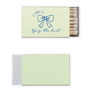 Spark excitement for the upcoming nuptials with the Bow Tying the Knot Bridal Matchbook, personalized with the bride's name elegantly arched over a stylized bow graphic. The phrase "Tying the Knot" in a delicate script font completes the design, making for a memorable and functional keepsake from the bridal shower.