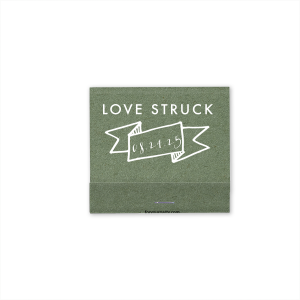 Ignite romance with the Love Struck Banner Matchbox featuring the smitten phrase above a banner cradling your special date. This design charmingly captures the couple's love, making each strike a celebration of their union.
