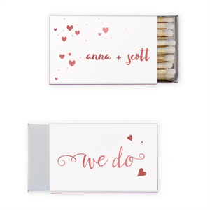 Proclaim your love with the We Do Name Heart Wedding Matchbox. Featuring the timeless words "We do" in elegant script and a heart symbol, this design beautifully signifies the couple's unity. A charming nod to the commitment that seals the deal!