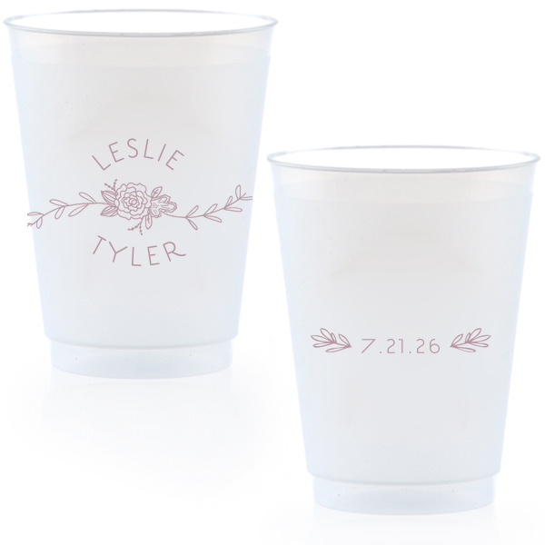Captivate your guests with the Peony Flourish Names Frosted Cup, featuring a charming heart-leaf flourish and a central peony. This elegantly stacked design beautifully intertwines the couple's names, creating an air of sweet simplicity and sophistication for your memorable celebration.