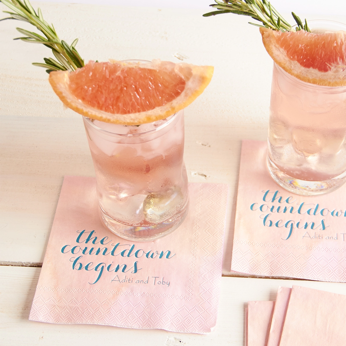 summer grapefruit and gin cocktail on a watercolor personalized cocktail napkin