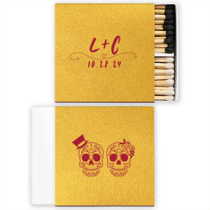 Celebrate eternal love with the Skull Couple Wedding Matchbox. Adorned with delightful sugar skulls, these matchboxes honor Dia de los Muertos—celebrating life and love. The back features the newlywed's initials and the event date, making it a unique token of vibrant tradition and joy.
