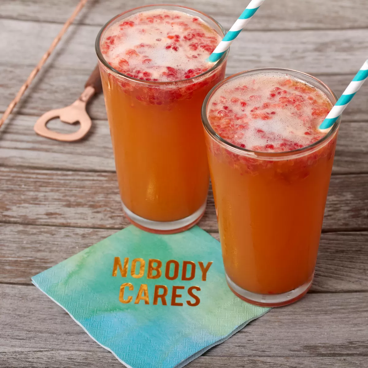 raspberry beermosa for summer brunch with a sea glass water color napkin