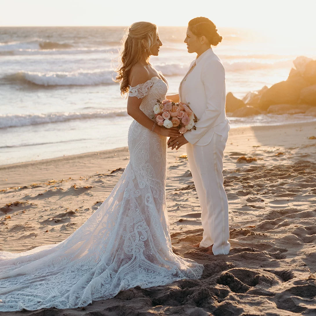beach wedding sunset picture with two brides in Malibu