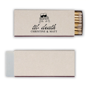 Find the perfect match with the Til Death Toast Match. Heat things up at your event with this striking accessory. Adorned with two skeletal hands clinking wine glasses above personalized text, they are perfect for seasonal weddings or Halloween events.