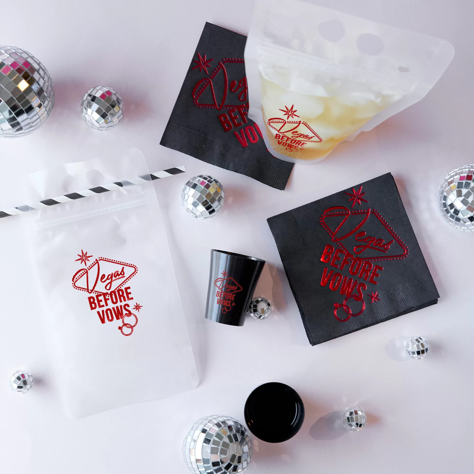 Party scene with Vegas napkins, pouches and shot glasses