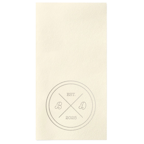 Infuse your reception with the bespoke elegance of the Circle Badge Initials Napkin, reminiscent of an exclusive club crest. 'EST.' and the wedding year anchor the design, with the couple's scripted initials nestled within the distinguished bands, crafting a personal insignia of love.