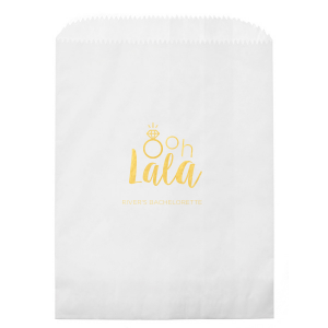 Delight guests with the Ooh Lala Bachelorette Bag, where a glimmering solitaire ring cleverly becomes the 'O' in 'Ooh.' 'Lala' whimsically precedes the bride-to-be's name, making this bag a charming memento of celebration and friendship.