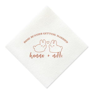 Hop into matrimonial joy with the Some Bunnies Wedding Napkin, complete with an adorable drawing of two bunnies and a heart nestled between them. The playful phrase "Some Bunnies Getting Married" sets a whimsical tone, while the area below awaits the couple's names, scripted with modern elegance. A delightful addition to your wedding tablescapes.