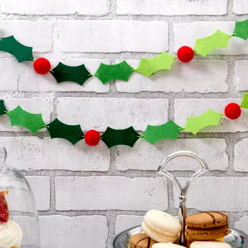 Add a felt banner of holly and berries to your décor this Christmas