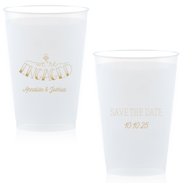 The Diamond Engagement Cup design dazzles with a sparkling diamond graphic and bold "ENGAGED" in 3D artistry. Scripted "we’re" and the couple's names add charm, while the other side cheerfully announces "Save the Date," infusing the cup with celebratory excitement and anticipation.