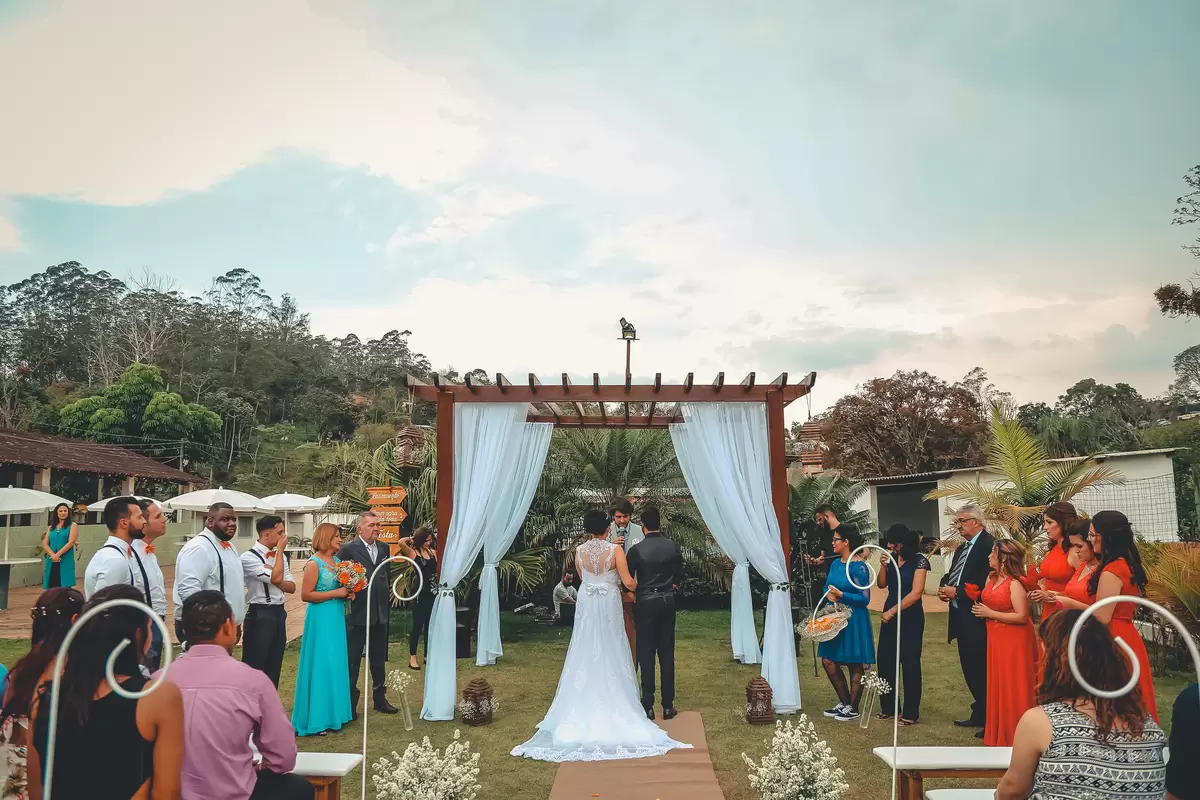 bride and groom standing at altar of an outdoor wedding