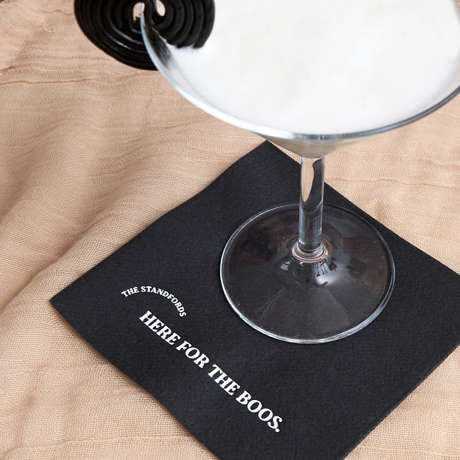 black napkin with the text "here for the boos"