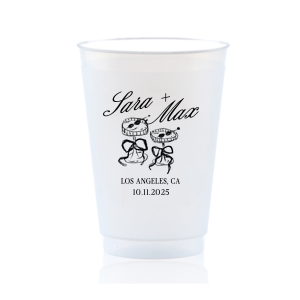 The Wedding Glass & Bow Cup is the must have trendy design for your one of a kind lifetime event. Featuring hand-drawn bows tied around champagne glasses alongside customizable text in the screen printed ink color of your choice to best pair with your party's vibe.