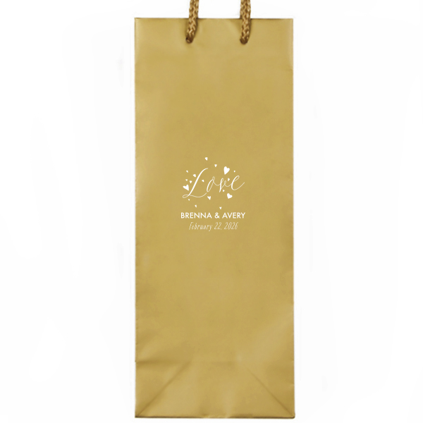 Let affection take flight with the Love and Hearts Bag, where 'Love' is joyfully scripted, surrounded by a flutter of hearts. Below, the couple’s names and date ground this exuberant design, making every gift a testament to their love's vitality.