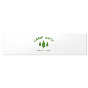 Label your bachelorette party essentials with the Camp Bachelorette Wilderness Label, featuring a serene forest scene topped with "Camp Bach" in an arch, evoking the spirit of adventure. An ideal accent for your camp themed bachelorette getaway.